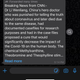 A WhatsApp message spouting lies about the pandemic is accompanied by a small string of text that says "Forwarded many times" and a small magnifying glass icon.